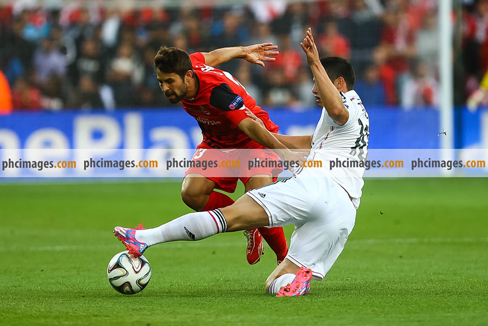James Rodriguez slides in for a challenge