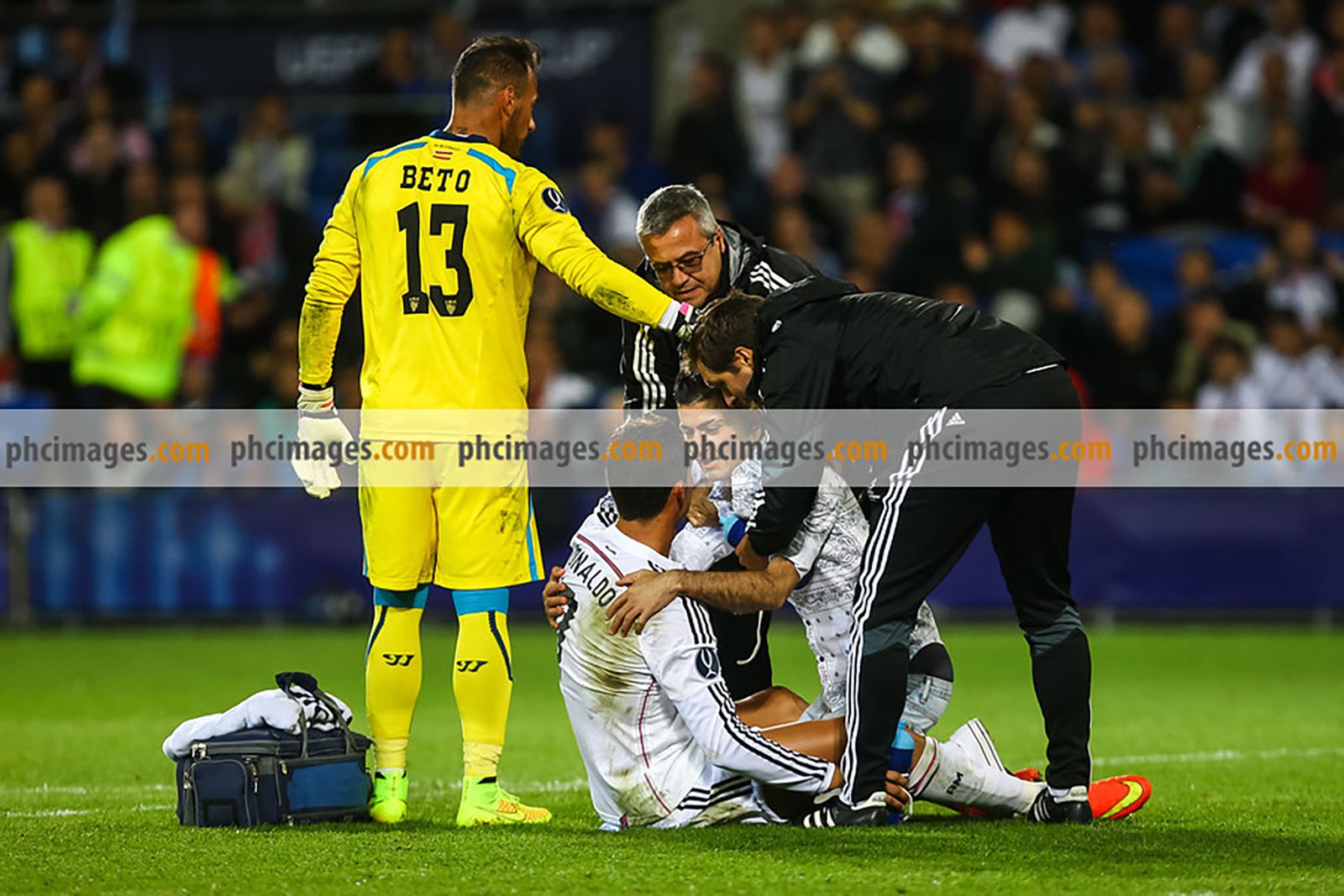 A fan runs on the pitch to greet his hero Ronaldo