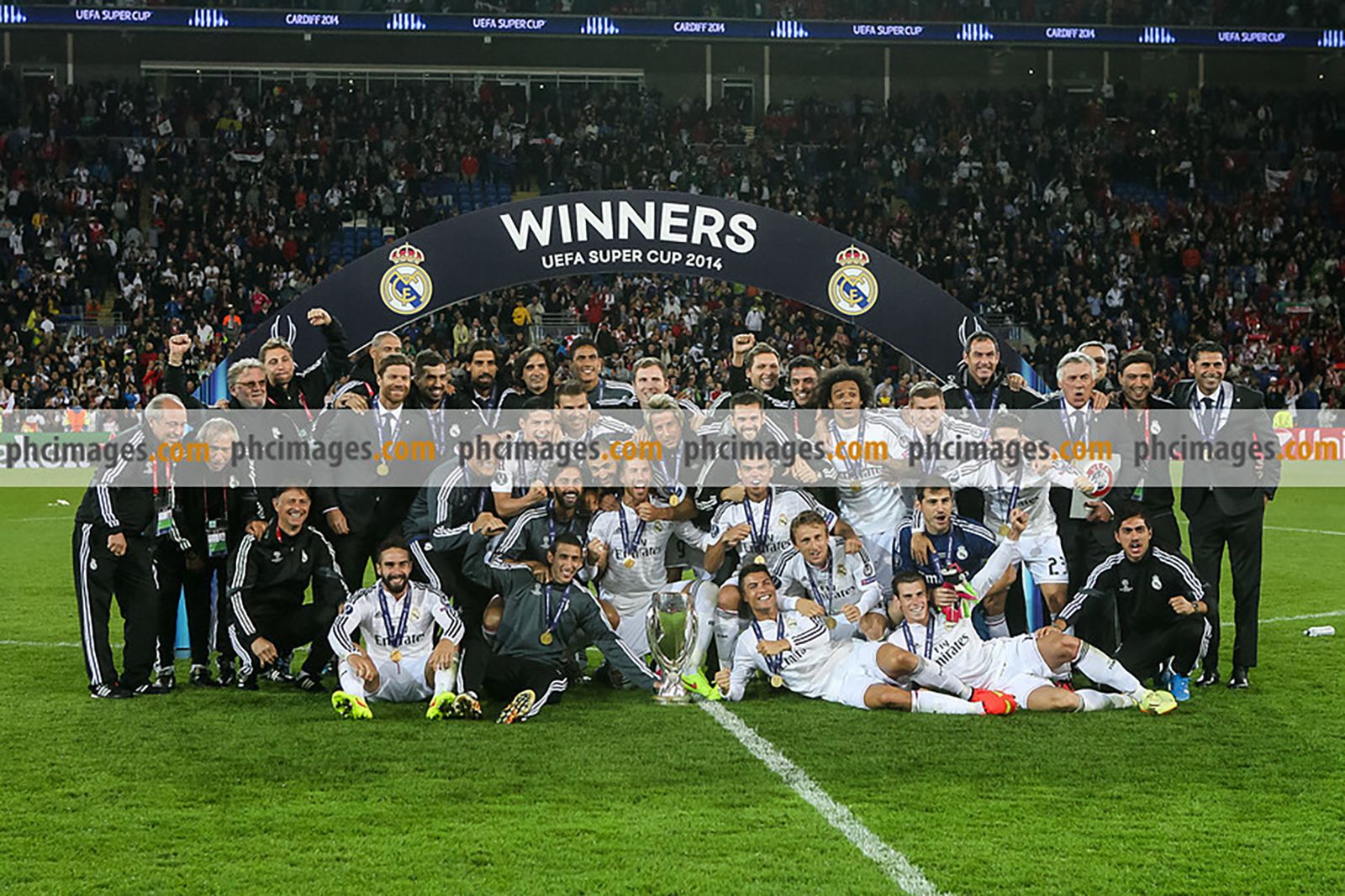 Real Madrid pose on the pitch