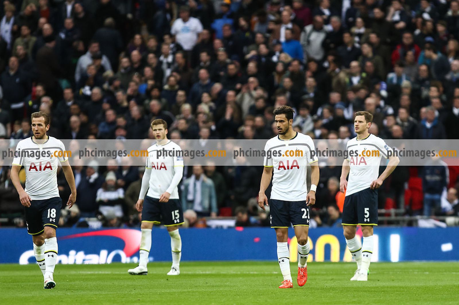Spurs players look dejected after conceding their first goal