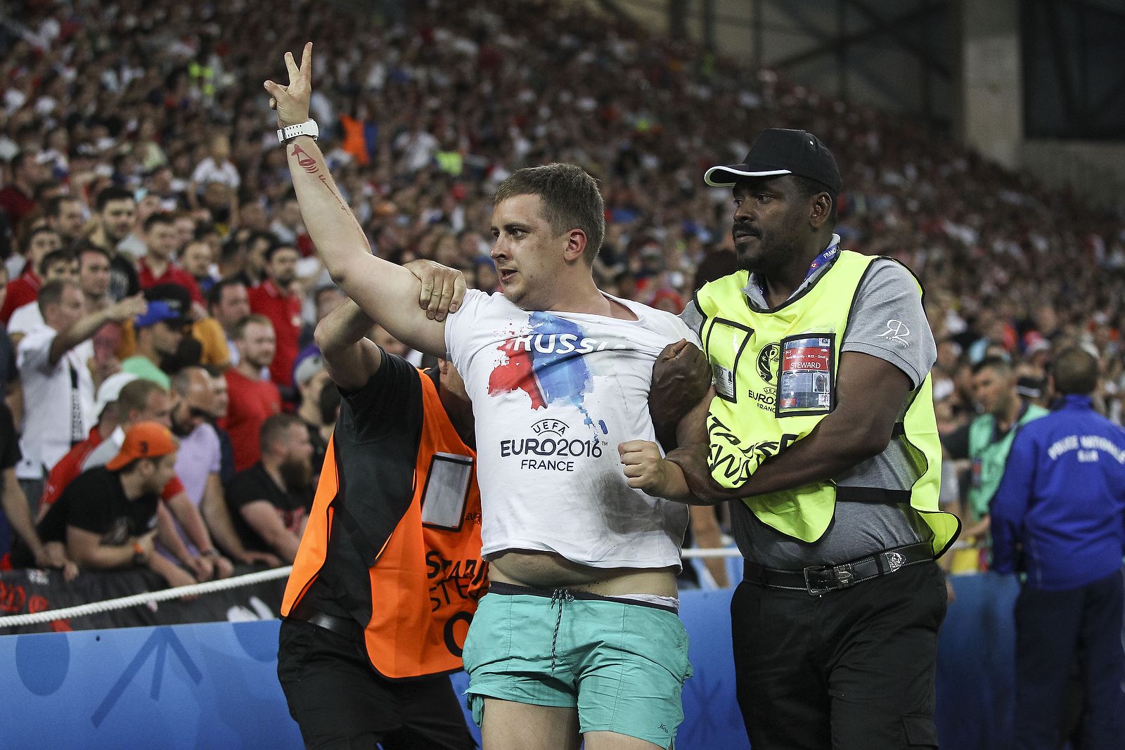 A Russian fan is ejected
