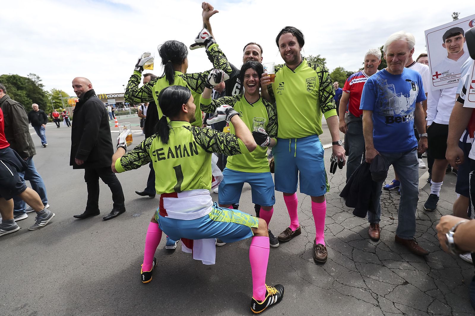 England fans dressed as David Seaman pose outside before the match