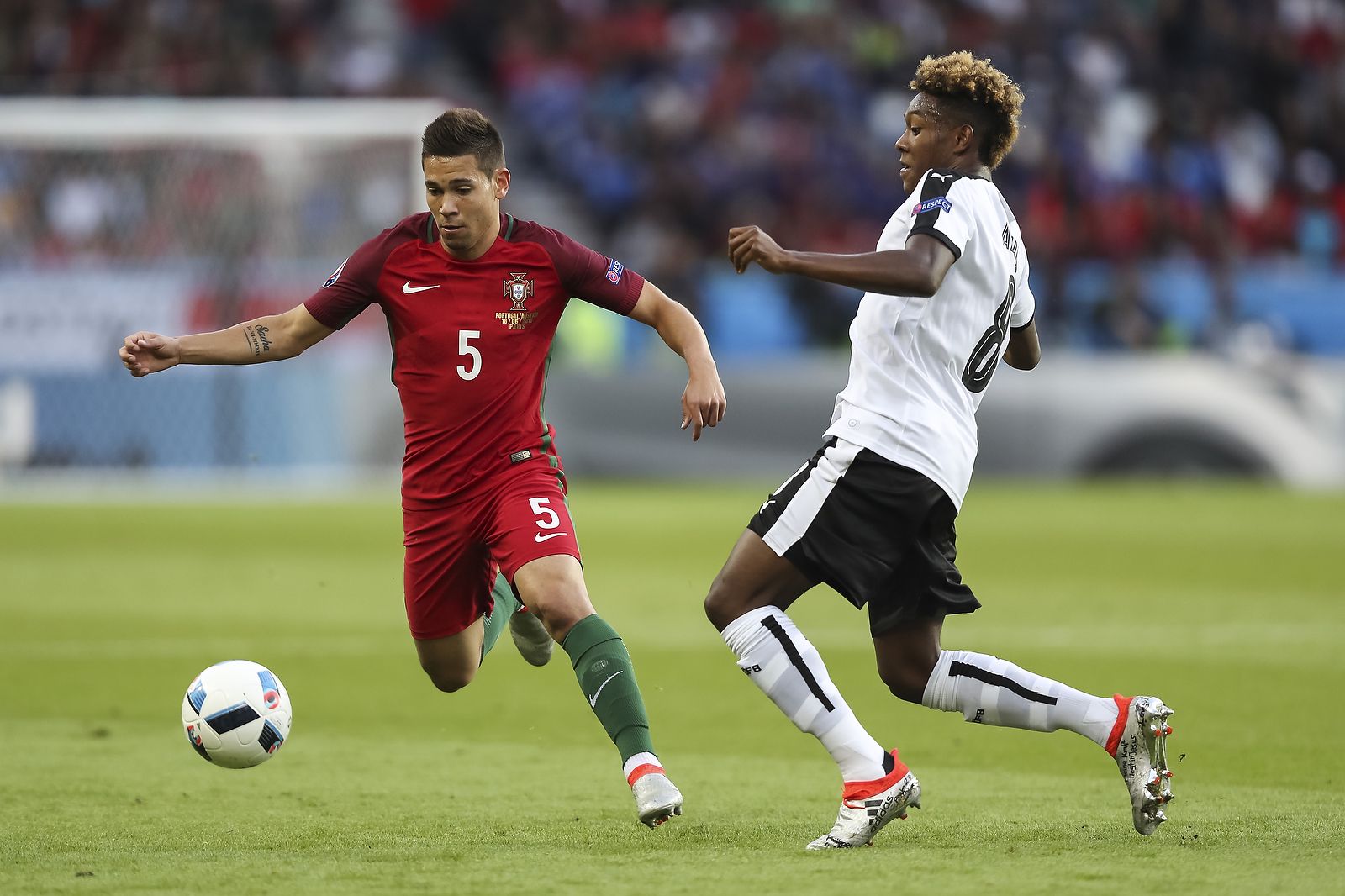 Raphael Guerreiro of Portugal and David Alaba of Austria