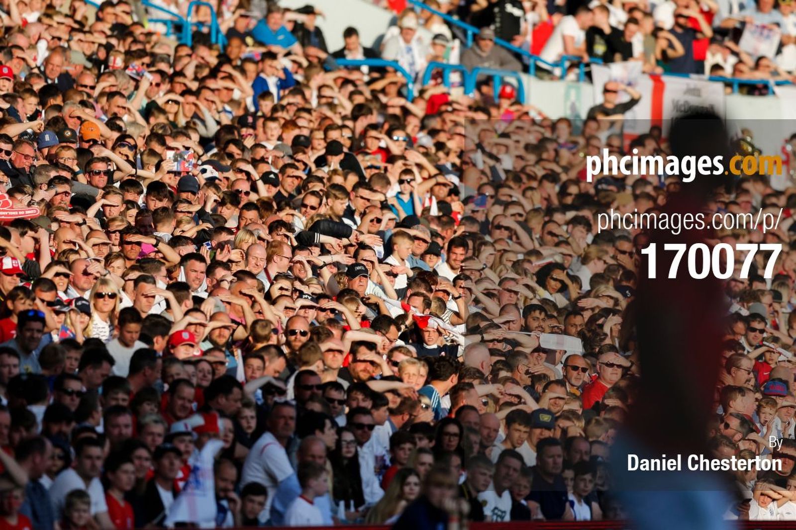 England fans shield their eyes from the sun