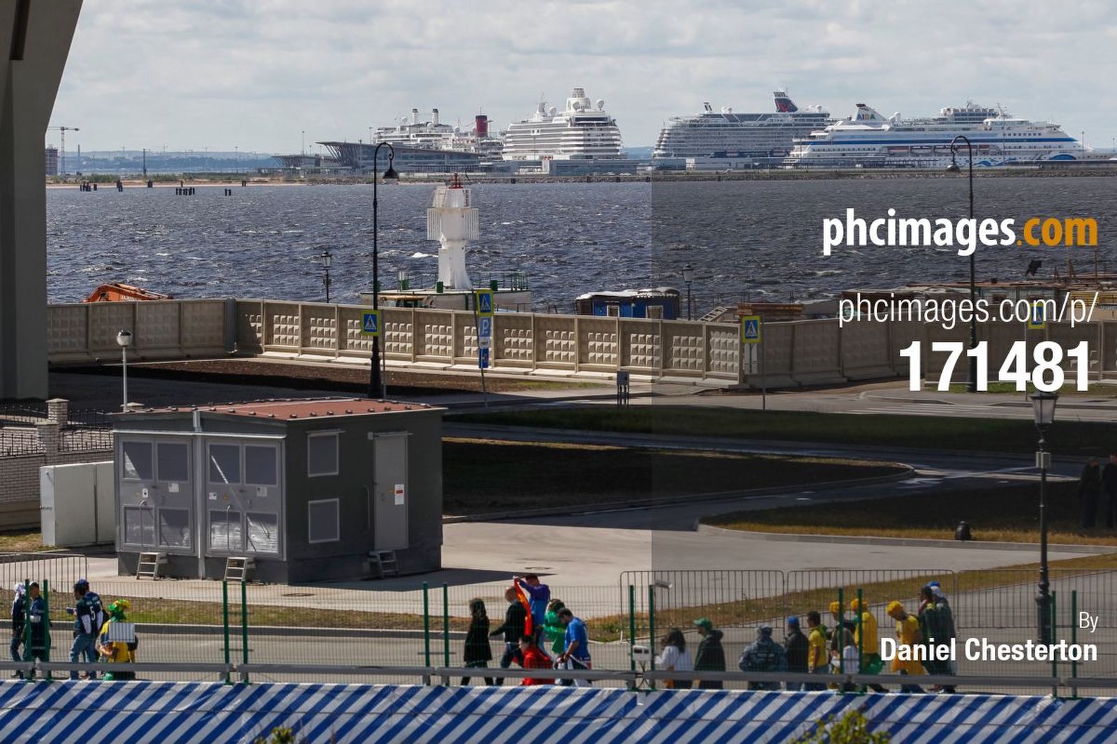 Fans make their way to the stadium past massive cruise ships in the Gulf of Finland