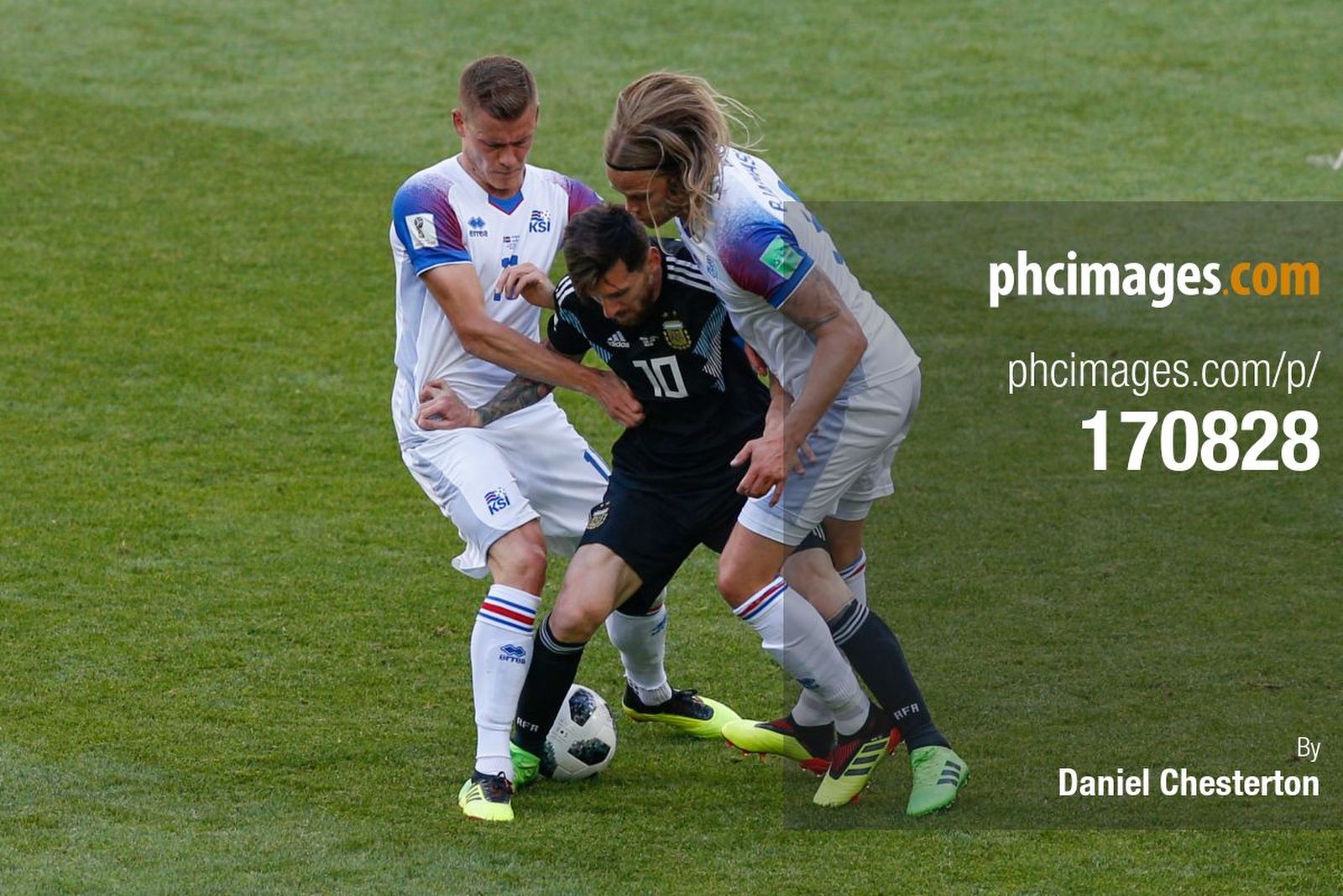 Messi takes on Alfred Finnbogason and Birkir Bjarnason