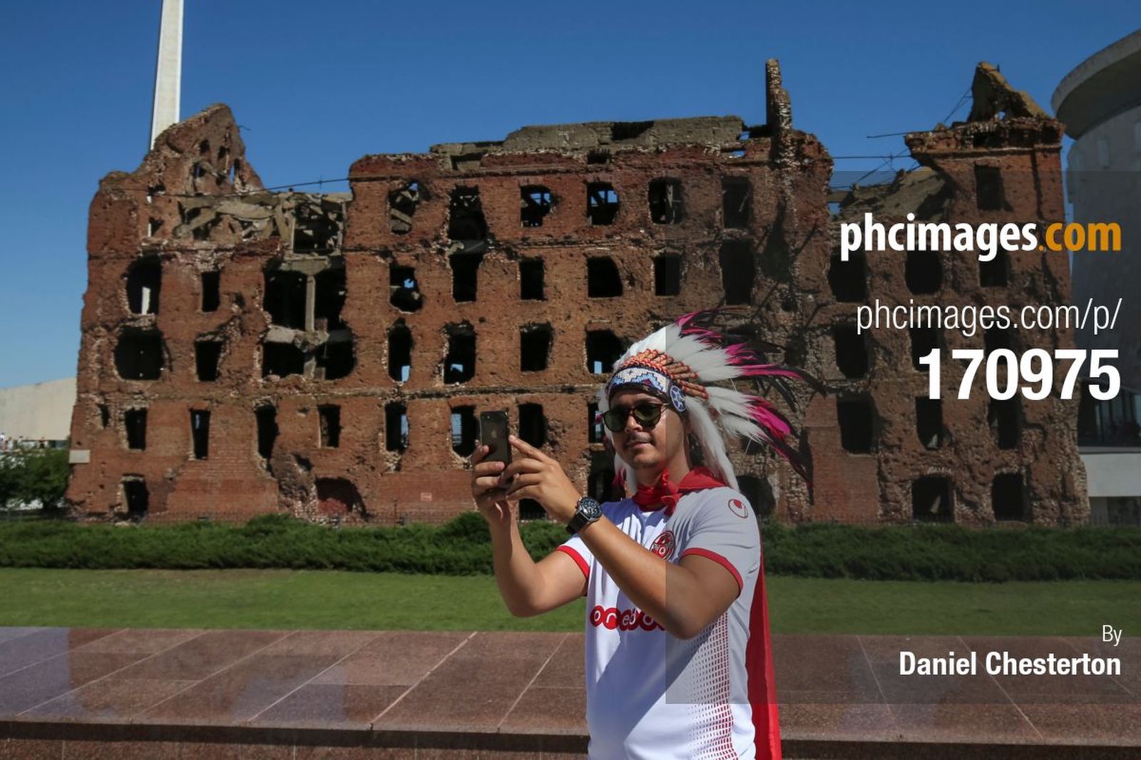 A Tunisia fan takes a selfie in front of Grudinin’s Mill