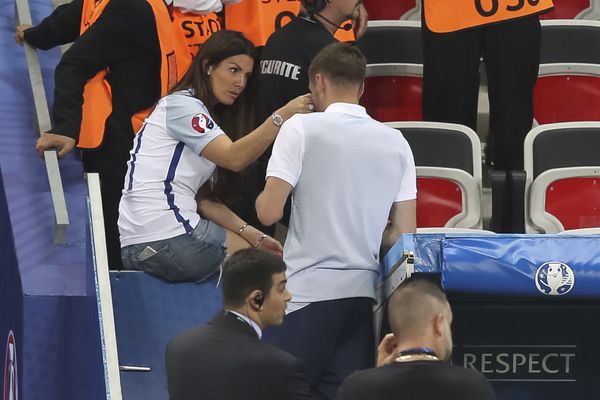 Rebekah Vardy wipes tears from her husband, Jamie Vardy