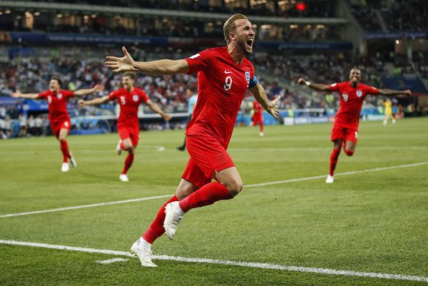 Harry Kane celebrates his stoppage time winner against Tunisia