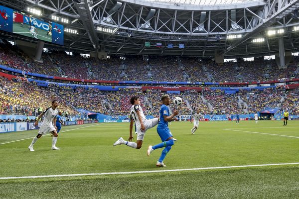Neymar of Brazil flicks the ball over Yeltsin Tejeda of Costa Rica