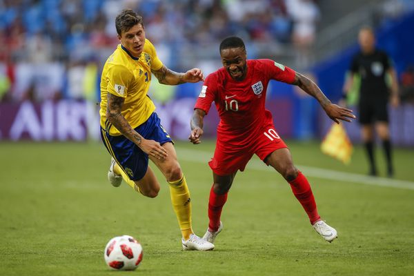 Victor Lindelof of Sweden and Raheem Sterling of England