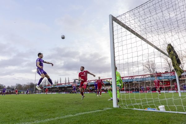 Portsmouth's John Marquis heads the ball at goal
