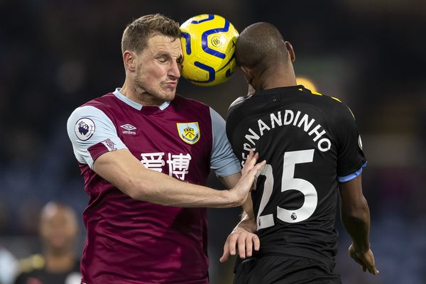 Chris Wood and Fernandinho jump for a 50/50