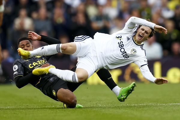 Leeds' Brenden Aaronson is fouled by Jacob Ramsey of Aston Villa